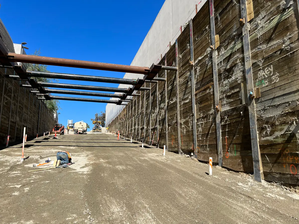 Cross-lot bracing inside the Intuit Dome entrance excavation